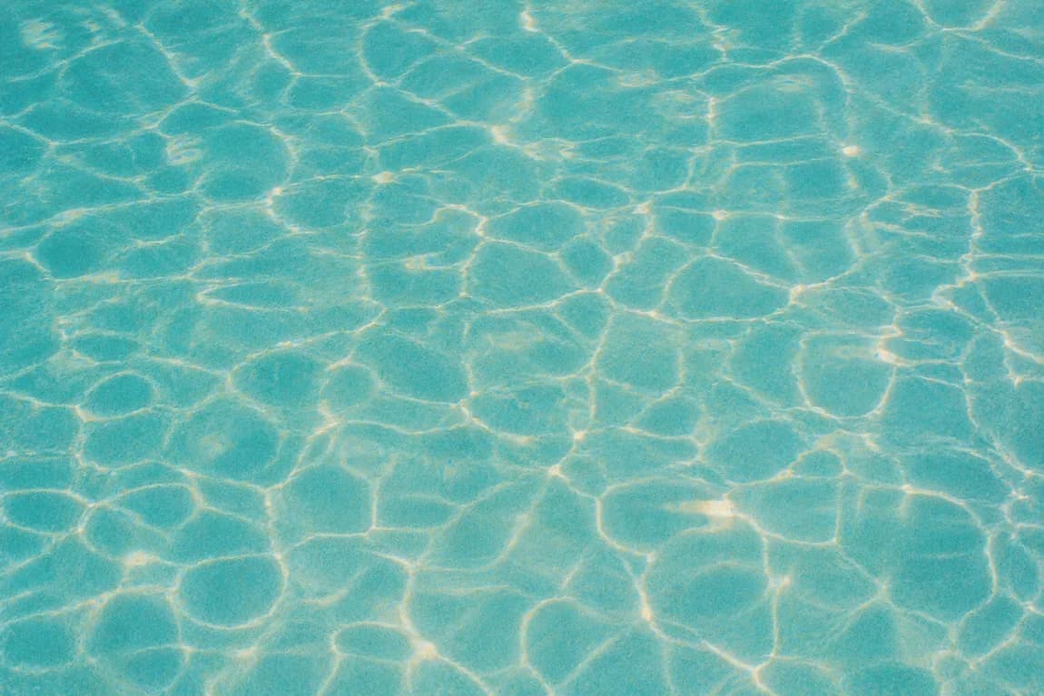 Sunlit turquoise pool water